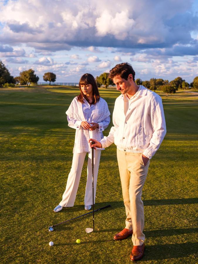 The View Bouznika Hotell Eksteriør bilde Golfers wearing white